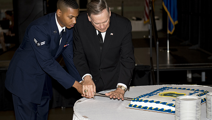 Airman 1st Class Christopher Smith, 823rd Base Defense Squadron fire team member, and Retired chief of staff Gen. John Jumper, perform a cake cutting ceremony, during the 820th Base Defense Group’s 20th Anniversary Celebration, March 29, 2017, in Valdosta, Ga. Jumper was a command pilot with more than 5,000 flying hours, including 1,400 combat hours. The celebration included an 820th BDG capabilities demo, a reenlistment ceremony and a formal dinner. (U.S. Air Force photo by Airman 1st Class Daniel Snider)